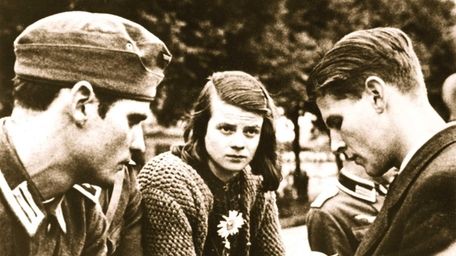 Sophie Scholl, center, with her brother Hans Scholl,