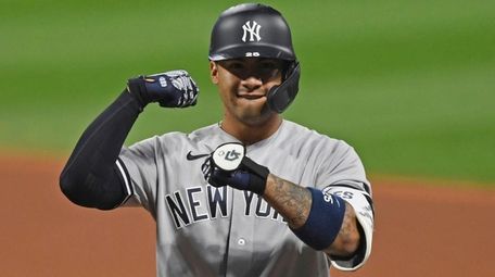 The Yankees' Gleyber Torres celebrates after hitting a