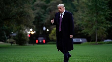 President Donald Trump walks from Marine One to