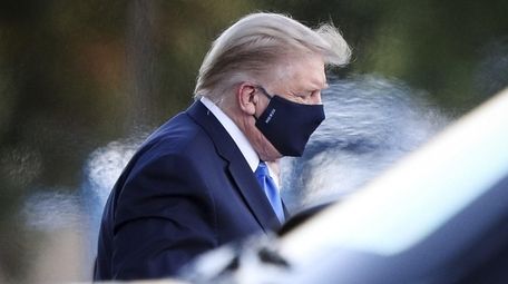 President Donald Trump exits Marine One while arriving