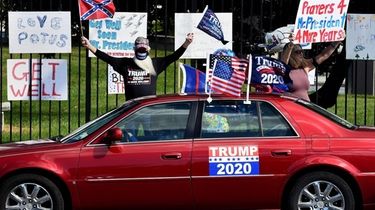 Supporters of President Donald Trump gather outside Walter