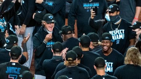 Miami Marlins manager Don Mattingly celebrates with the