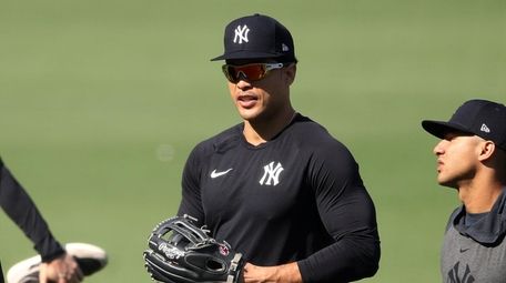 Giancarlo Stanton #27 of the Yankees warms up