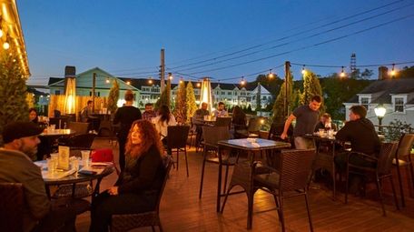 Patrons enjoy outdoor dining on Roslyn Social's heated