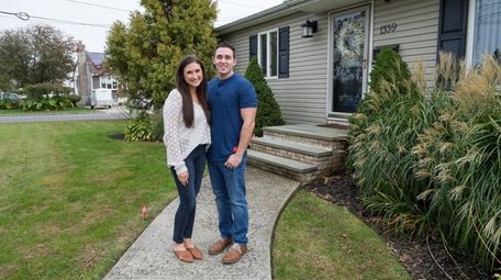 Nicole and Cory Fraile, outside their West Babylon