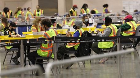 Workers count ballots on Election Day in Philadelphia.