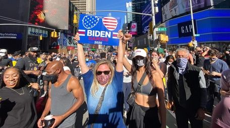 People celebrate at Times Square in Manhattan after