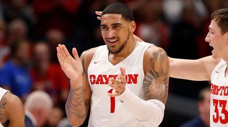 Obi Toppin of the Dayton Flyers reacts after