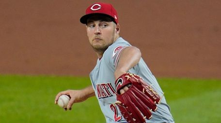 Reds starting pitcher Trevor Bauer delivers during the