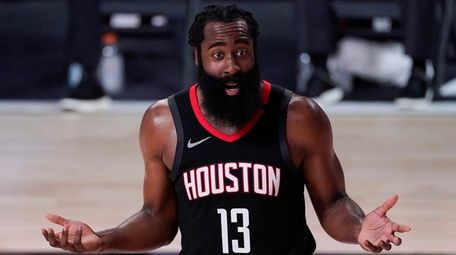 The Rockets' James Harden argues a call during