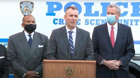 NYPD Police Commissioner Dermot Shea, center and Mayor
