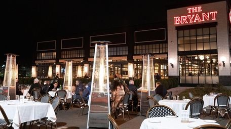 Outdoor seating with heaters at The Bryant in