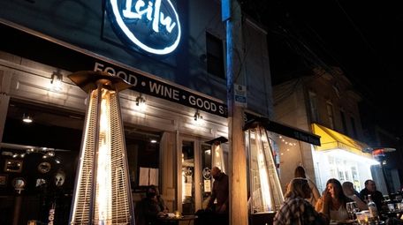 Outdoor seating with heaters at Leilu in Huntington.