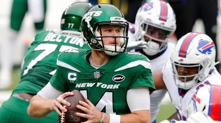 Sam Darnold of the Jets looks to pass