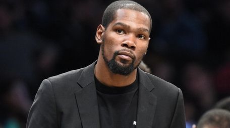 Brooklyn Nets' Kevin Durant looks on during a