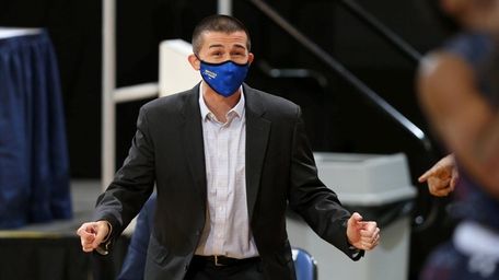 Hofstra acting head coach Mike Farrelly shouts instructions