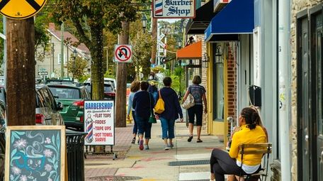 Pedestrians on Main Street in Farmingdale, as seen