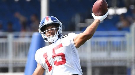 Giants wide receiver Golden Tate throws the football