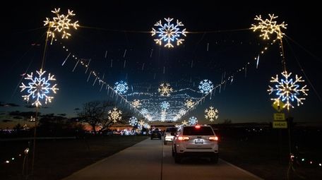 Motorists drive through the Magic Lights show at