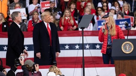 President Donald Trump shares the stage on Dec.