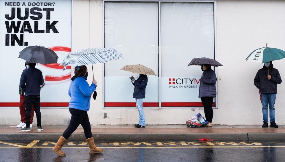 People use umbrellas to shield themselves from the