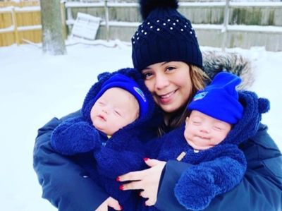 Christina Ortega of Huntington holds her twin sons,