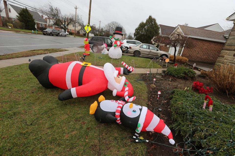 Fallen Christmas decorations on the lawn of a