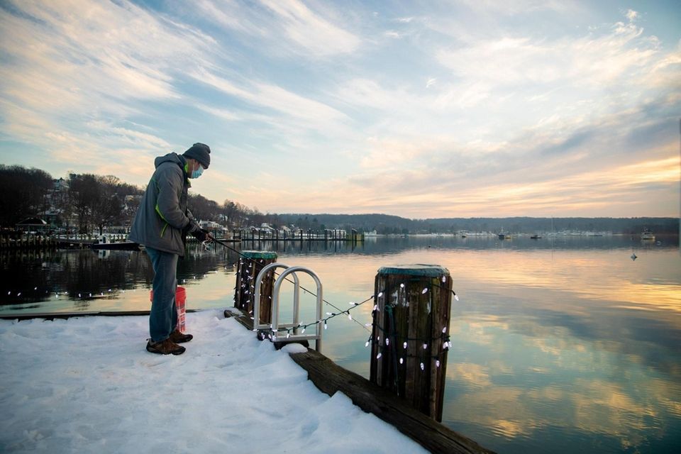 Shintaro Nokuchi of Northport fishes off the dock