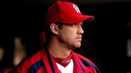 Scott Rolen of the Cardinals looks on from