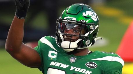 Marcus Maye of the Jets reacts after breaking