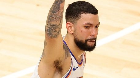 Austin Rivers of the Knicks reacts after hitting