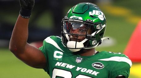 Marcus Maye of the Jets reacts after breaking