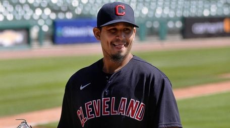 Cleveland starting pitcher Carlos Carrasco walks to the