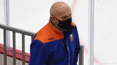 Islanders general manager Lou Lamoriello enters the arena