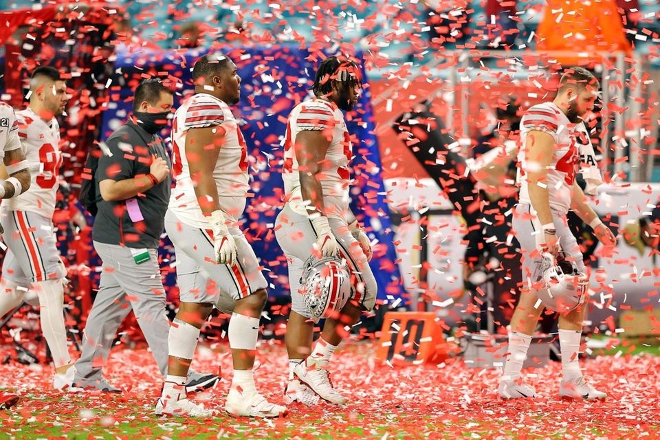 The Ohio State Buckeyes leave the field following