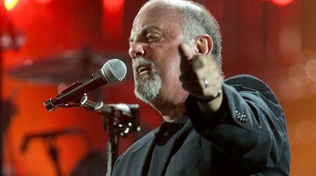 Billy Joel performs at Shea Stadium in July