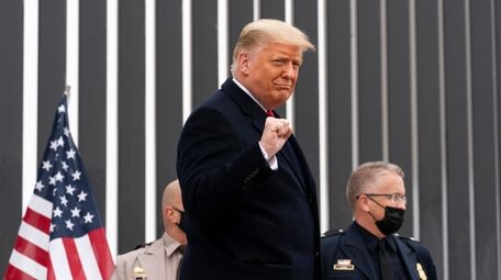 President Donald Trump pumps his fist as he