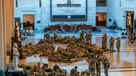 Hundreds of National Guard troops hold inside the