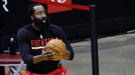 James Harden #13 of the Houston Rockets warms