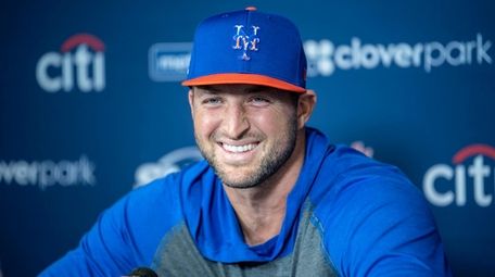 The Mets' Tim Tebow talks to the media