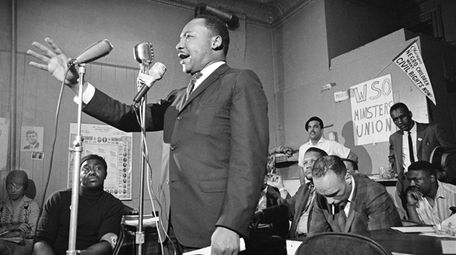 Martin Luther King Jr. addresses a meeting in
