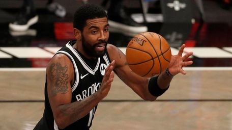 Kyrie Irving of the Nets controls the ball