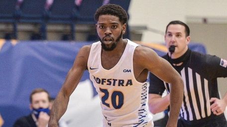 Hofstra's Jalen Ray driving down the court against