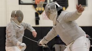 Omar Cruz of Huntington (left) takes on Robert