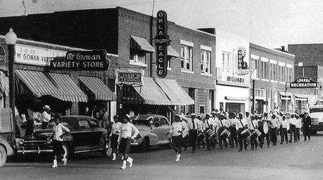 A band marches on Greenwood Avenue in Tulsa,
