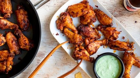 Roasted wings are finished in a Peruvian flavored