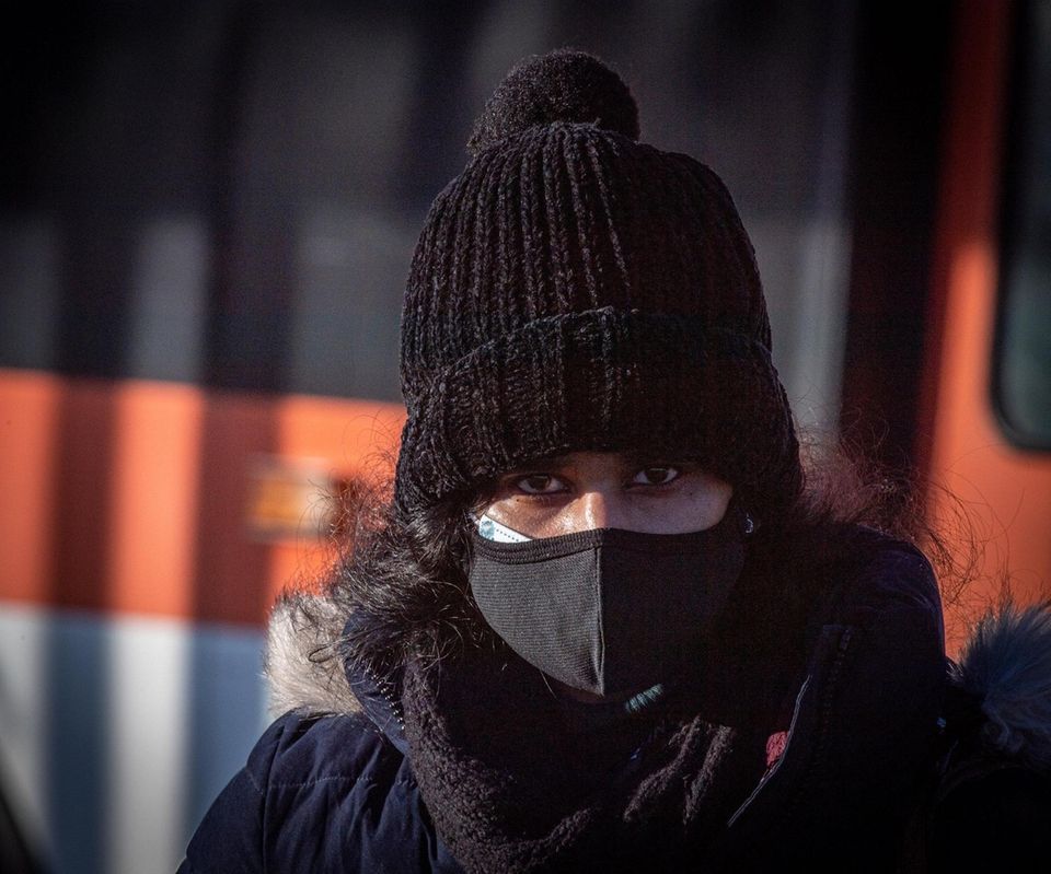 Commuters bundled up for the freezing cold weather