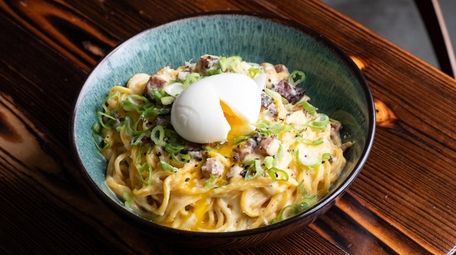 The Ramen Carbonara is made with peppered bacon,