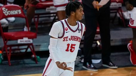 St. John's Vince Cole gestures after making a