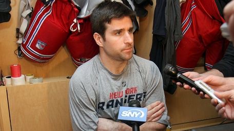 Chris Drury talks to press inside the Rangers'